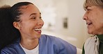 Senior patient, laughing or happy caregiver talking for healthcare support at nursing home clinic. Smile, women or nurse speaking of joke to a funny mature person or woman in a friendly conversation