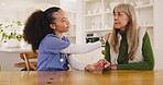 Senior, nurse and empathy with support and consulting for healthcare at table in retirement home with counseling. Caregiver, elderly person and sympathy for mental health, therapy or wellness help
