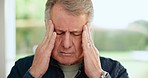 Headache, senior man and stress at home from retirement, debt or depression from anxiety. Migraine, dementia worry and tired elderly male person in a house with mental health, head massage and pain