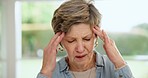 Headache, senior woman and pain at home from retirement, debt or depression from anxiety. Migraine, dementia worry and tired elderly person in a house with mental health, head massage and stress