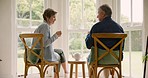 Old couple in home, tea and bonding in morning with love, support and conversation. Relax, senior man and woman at table, drinking and discussion, marriage in retirement and communication with trust.