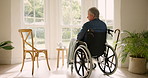 Wheelchair, thinking and elderly man in nursing home by window, depression and mental health. Sad, senior person with a disability and lonely in retirement house with idea, remember memory or dream