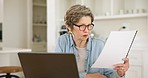 Senior woman, documents and taxes with laptop, reading or thinking for inspection to check paperwork. Old lady, audit and contract for insurance, investment and financial review with computer in home