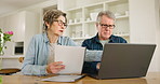 Fight, laptop and senior couple doing budget or finance planning in a home for retirement and frustrated by paperwork. Document, crisis and angry elderly people in debt, expenses and fail together