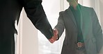 Business people, shaking hands and speaking in meeting for financial investment, negotiation or welcome in lens flare. Corporate clients handshake, deal or introduction of collaboration or consulting