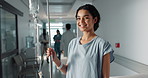 Iv drip, patient and portrait of happy woman in a hospital or clinic corridor with treatment for recovery from surgery. Intravenous, medicine and person with medical insurance for care and health