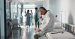 Depression, grief or fail with a mature doctor in a hospital looking unhappy for healthcare or medical. Stress, mistake or loss with a sad man medicine professional in a professional medicare clinic