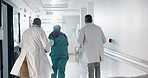 Doctors, group and running in corridor for emergency, surgery and healthcare work in hospital. Medical teamwork, men and women with call in hallway for wellness, care and support with back in clinic