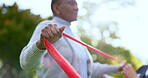 Senior, black woman and nurse with stretching band for exercise, wellness or physiotherapy outdoor at park with lens flare. Caregiver, person or workout, training or physical therapy for healthy body