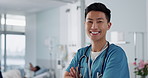 Medicine, doctor and asian man with arms crossed at hospital with smile for support, service and wellness. Healthcare, professional or expert with happiness and pride for career, surgery or insurance