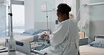 Woman patient, bed and drip in hospital, sick or treatment for hydration, liquid or supplement. African person, health or wellness for blood transfusion, anesthesia or pharma drugs for pain in clinic