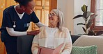 Tablet, nurse and senior woman on sofa browsing on internet for medical consultation research. Bond, healthcare and African female caregiver talk to elderly patient networking on technology at home.