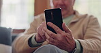 Parkinsons, smartphone and hands of senior man typing online on internet search in retirement home. Phone, elderly person with a disability and scroll on health website, communication or social media