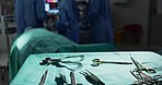 Surgery, health and tools in operation theatre, help in medicine with treatment and closeup of equipment on table. Metal, medical and surgical instrument with doctor people at hospital for healthcare