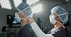 People, doctor and nurse while getting ready for surgery in hospital with mask for protection, health or safety. Person, side profile and medicine with team, medical theatre and dress for operation