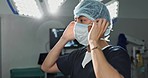 Surgery, doctor and man with face mask in hospital theatre for medical service, preparation and operation. Healthcare, safety scrubs and person with uniform for emergency, procedure and protection