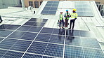 Construction, team or top view with solar panel outdoor for construction, design and inspection. Photovoltaic, people or planning or blueprint with discussion, conversation or collaboration on roof