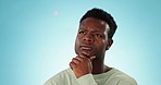 Thinking, confused and black man with solution, questions and doubt with decision on a blue studio background. African person, choice and model with brainstorming, problem solving and mockup space