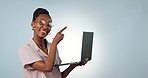 Laptop, pointing or face of black woman in studio for social media mockup space or copywriting research. Ecommerce, blog or happy African person editing online for promo news on a white background