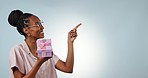 Black woman, pointing or gift box mockup for present or birthday isolated in studio on white background. Smile, space or happy lady giving prize or giveaway to celebrate a surprise, package or parcel