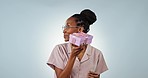 Shake box, excited or face of person in studio isolated on a blue background with product. Happy, guess or black woman with present for party, celebration of holiday or birthday package for giveaway