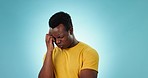 Stress, anxiety and black man with headache in studio angry with pain, mistake or tension on blue background. Vertigo, crisis and African male model frustrated with brain fog, tinnitus or burnout