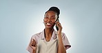 Phone call, talking or face of black woman in studio on blue background for communication or chat. African, smile or person listening in conversation or speaking of good news, feedback or networking