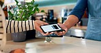 Customer, barista and pos machine with phone for payment, transaction or checkout at cafe. Closeup of person, hands and paying with smartphone tap for coffee, tea or beverage at cafeteria restaurant