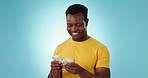 Happy black man, cash and counting money for finance, savings or investment against a studio background. African male person smile with dollar bills, paper or notes in financial freedom or profit
