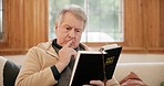 Holy, reading and senior man with a bible on sofa in the living room for spiritual wellness. Peace, gratitude and elderly male person in retirement studying christian religion book in lounge at home.