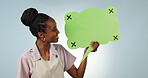 Business owner, face or speech bubble in studio for social media, advertising or logo branding. Blue background, happy black woman or African waitress showing chroma key or mockup space for launch