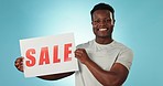 Happy black man, billboard and sale sign for promotion, discount or advertising against a studio background. Portrait of African male person smile with poster for retail special, deal or store promo