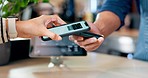 Phone payment, hands and closeup of a coffee at a cafe with an interaction at a desk with a waiter. Morning, shopping and a barista with a machine to pay with a mobile for a drink at a restaurant