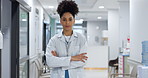 Healthcare, face and woman or doctor with arms crossed for wellness, trust and service in hospital or clinic. Portrait, person or expert with leadership for career, cardiology or nursing at workplace