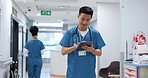 Walking, tablet or doctor in hospital with research on social media to search for medicine info online. Asian man reading, smile or medical healthcare nurse browsing on technology for telehealth news