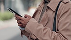 Phone, hands and closeup of typing outdoor, social media and writing email. Smartphone, business woman and scroll on technology, networking and communication for internet search on mobile app online