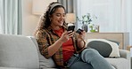 Happy woman, phone and credit card on sofa for payment, online shopping or banking in living room at home. Female person or shopper smile with debit and mobile smartphone for bank app or ecommerce