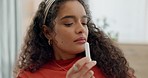 Woman, nose or inhaler for cold, flu or sinus relief on home sofa in medical, healthcare or wellness. Happy, relax or biracial person and nasal medicine equipment for breathing, allergy or congestion