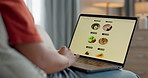 Hands, sofa and laptop screen for food delivery, restaurant menu and online shopping cart, check mark or choice at home. Person typing on computer e commerce, click and notification of order success