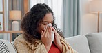 Allergies, sinus and sick woman sneezing on a sofa with tissue paper for nasal, cleaning or virus at home. Flu, stress and female blowing nose in living room with viral infection, bacteria or covid