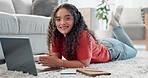 Woman, student and laptop for home education, e learning and college research, information and typing or relax on floor. Happy face of young person on computer in virtual school, internet or planning