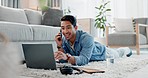 Phone call, computer and man on floor for remote work, working from home and freelance job. Networking, communication and person on laptop for planning, online conversation and discussion in house