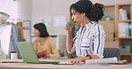 Laptop, planning and a woman designer drinking coffee in her office while working on a creative project. Computer, caffeine and a young employee working in a small business startup for design