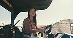 Woman, driving and farm tractor in field, farming and agriculture for ecology, green and sustainability. Green, eco friendly and energy with smile in countryside, agriculture and farmer equipment