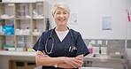 Vet smile, arms crossed and mature woman confidence in medical career, wellness clinic pride or healthcare work. Industry expert, portrait and senior veterinarian for veterinary care, help or service