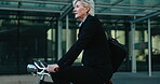 Businesswoman, commute and riding a bike to work, health and wellness. Mature person, urban and journey or transport to office, active and cardio in eco friendly, bicycle and carbon neutral footprint