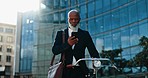 Mature man, smartphone and commute to work, bicycle and  texting, networking on social media. City buildings, office park and laptop bag to travel, type and read email for notification, worker or job