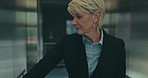 Senior business woman, elevator and office with thinking, click button or choice for floor. Mature corporate executive,  hotel and decision in lift, building or idea at finance company, agency or job