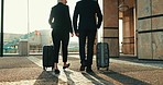 Suitcase, business travel and staff back at airport with walking and luggage for international work commute. Transportation, corporate people and mature employee ready for journey for job trip