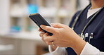 Woman, phone and nurse typing for research, social media or communication at pharmacy or hospital. Closeup of female person, medical or healthcare doctor on mobile smartphone app for networking